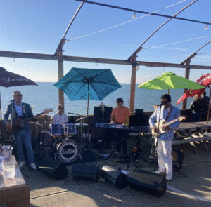 Band playing on a beach on a sunny day